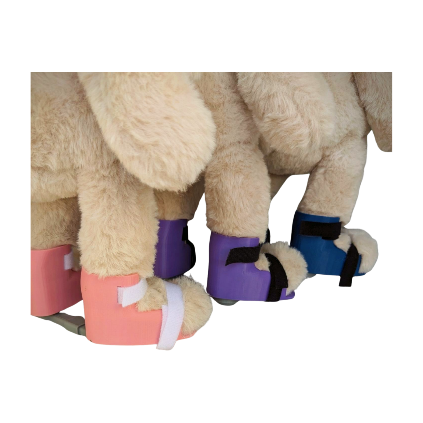 Stuffed bunnies with clubfoot braces in blue, pink, and purple, inclusive plush toys for clubfoot braces.