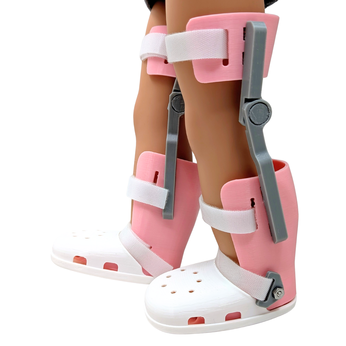 Pair of doll-sized KAFO braces with white shoes made from plant-based plastic, fits American Girl and similar dolls.